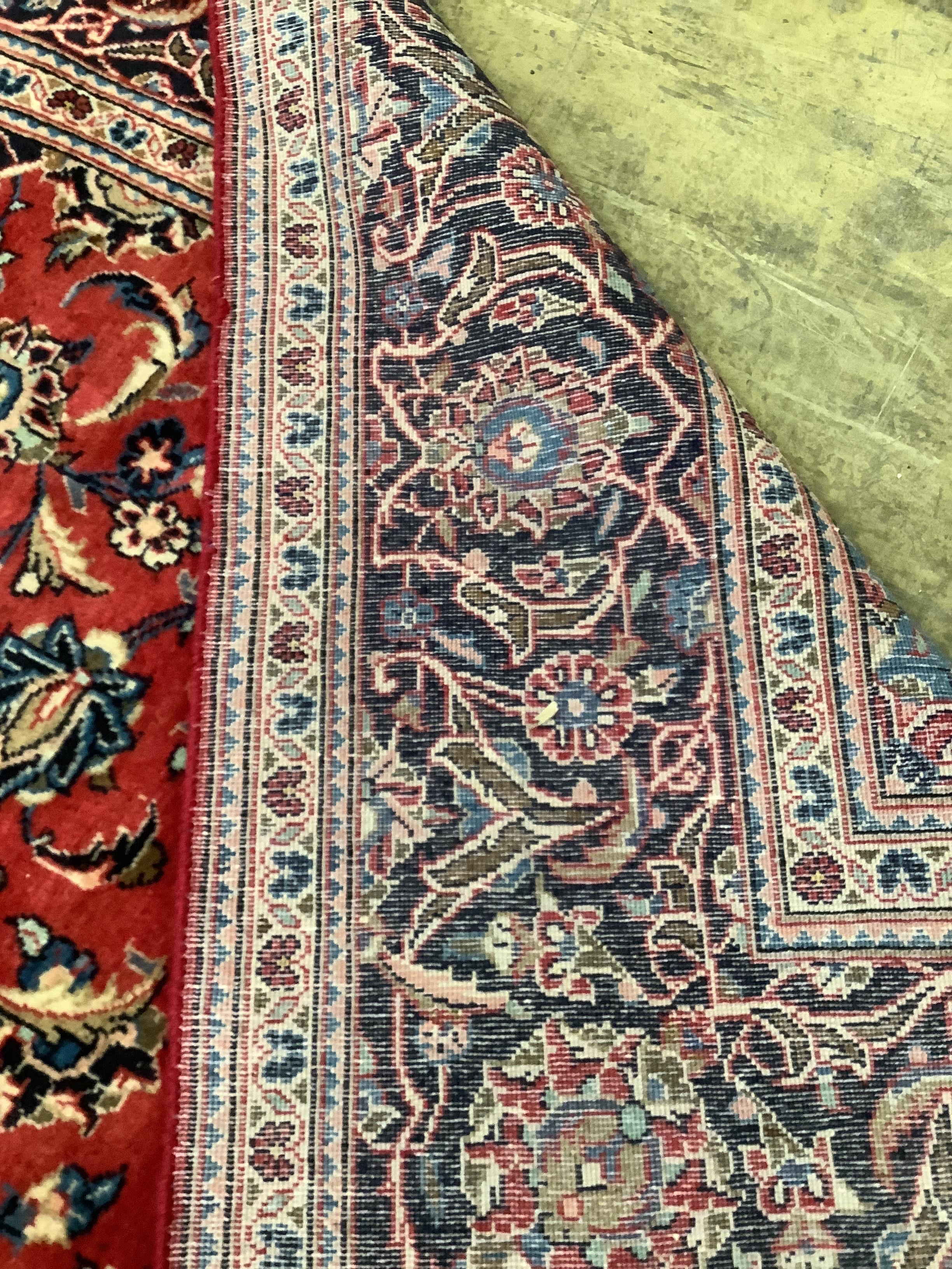 A Kashan red ground carpet, 308 x 190cm